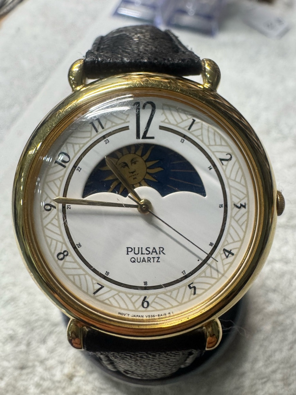 Pulsar Gold Tone Watch with White Dial and Black Strap
